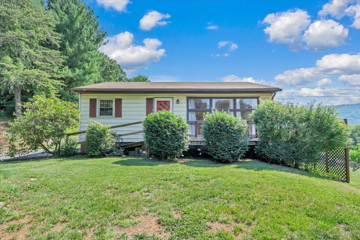 201 Long Avenue Covington, VA 24426 - Photo 38 of 43 a view of a house with yard and a garden
