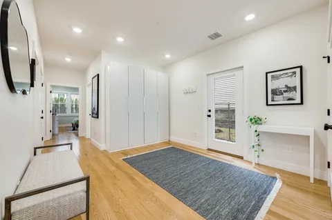 a view of a storage and utility room with washer and dryer