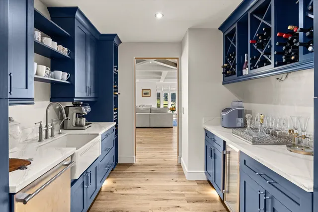 a bedroom with a large bed couch and a window