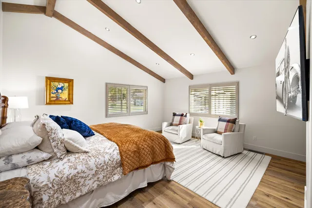 a bathroom with a shower and a glass door