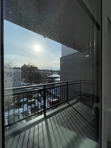a view of balcony with furniture