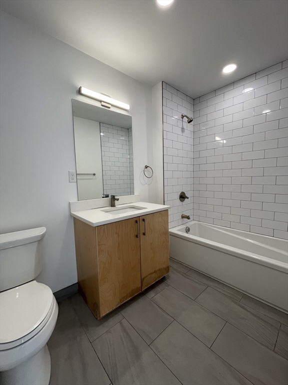 42 North Beacon Street, Unit 406 Boston, MA 02134 - Photo 7 of 14 a bathroom with a sink a toilet and bathtub