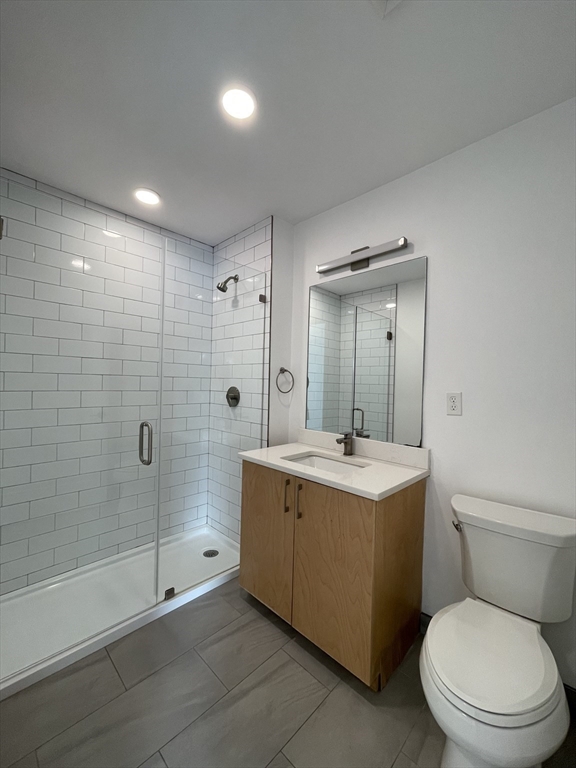 42 North Beacon Street, Unit 406 Boston, MA 02134 - Photo 9 of 14 a bathroom with a sink toilet and shower