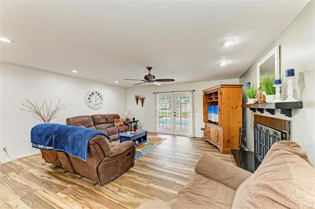 a bedroom with a bed and a tv on the dresser