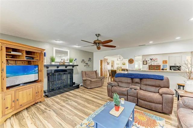a view of a room with wooden floor and window
