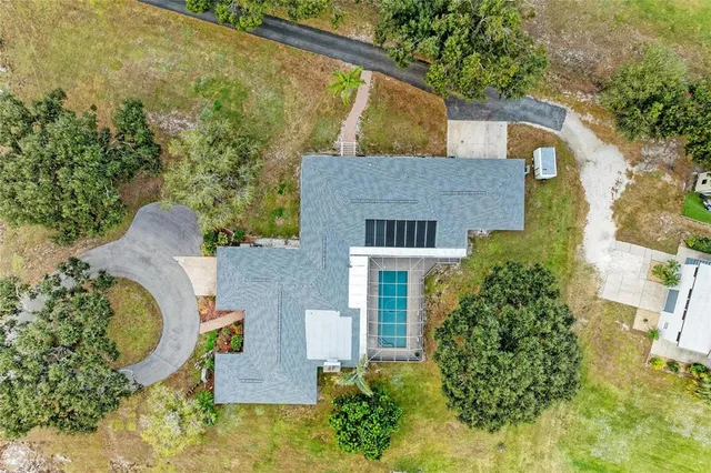 a view of a dining room with furniture and a chandelier