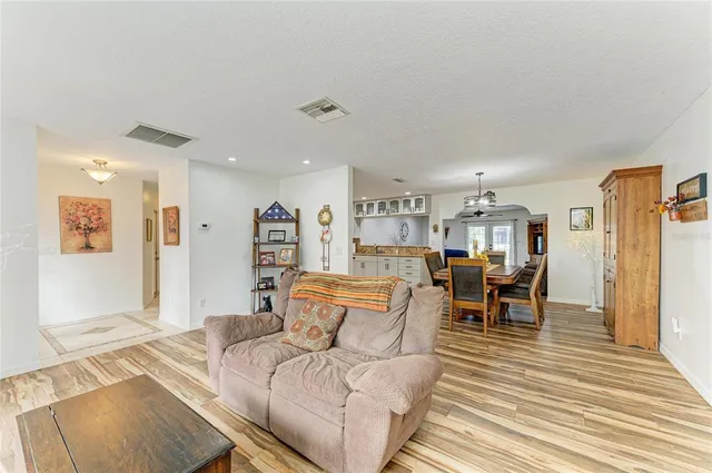 a front view of a house with swimming pool having outdoor seating