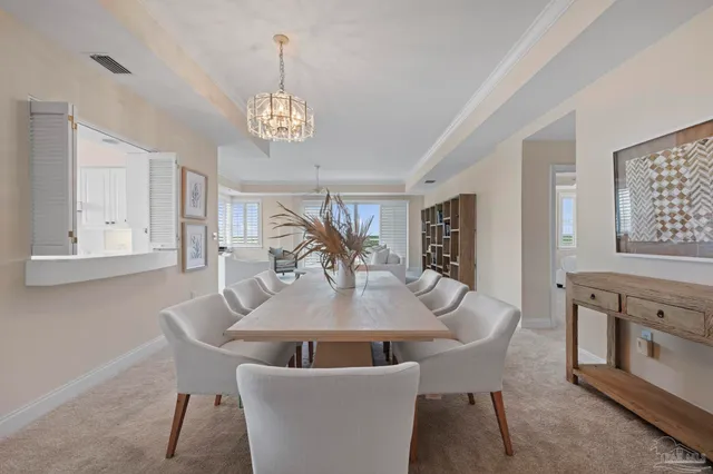 a kitchen with a stove a sink and cabinets