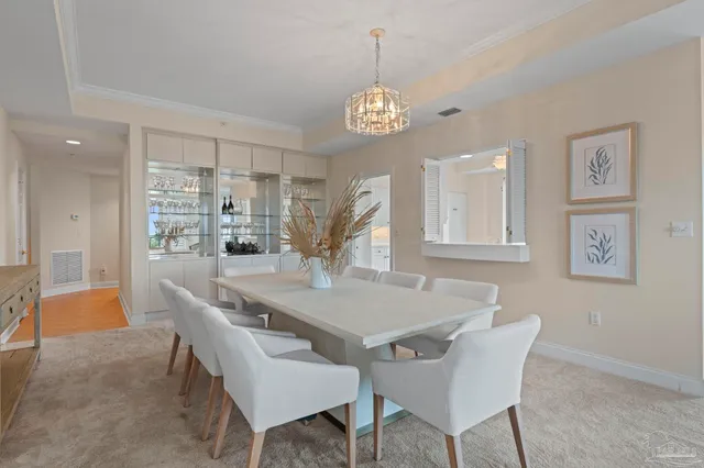 a kitchen with granite countertop white cabinets and a sink