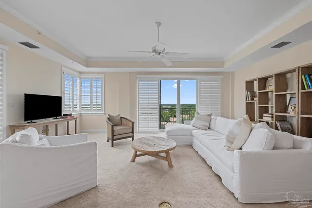 a kitchen with white cabinets and refrigerator