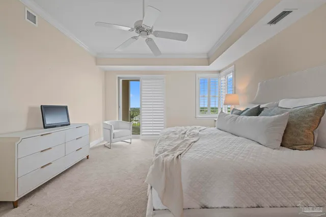 a bedroom with a bed and a ceiling fan