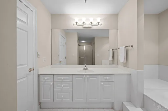 a bathroom with a sink toilet and a mirror