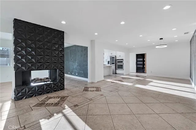 a bathroom with a toilet a sink and a shower curtain