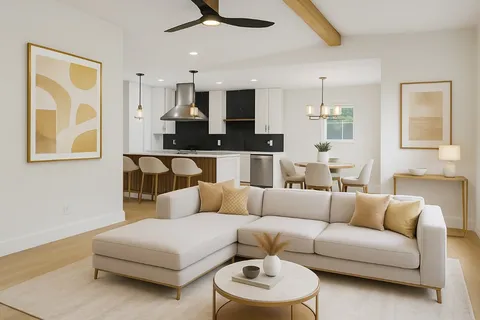 a living room with furniture and a view of kitchen