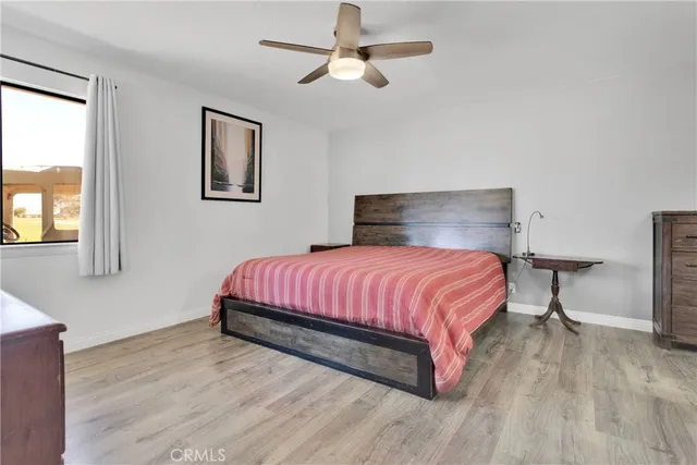 a bed room with a bed and a chandelier