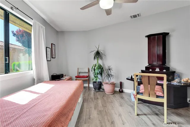 a bed room with a bed and a window