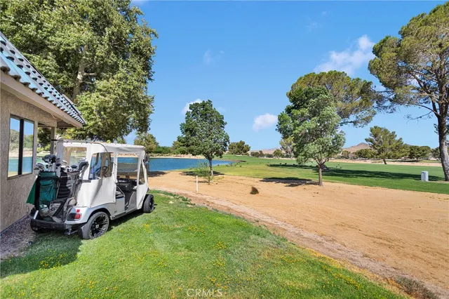 a view of a room with chairs and table
