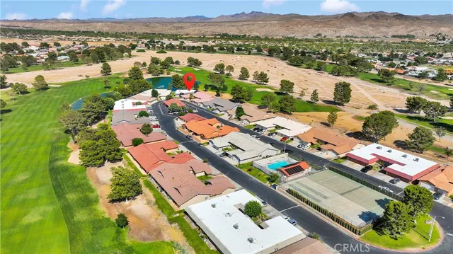 an aerial view of a house with a garden
