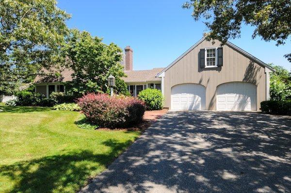 30 Leonard Road East Sandwich, MA 02537 - Photo 3 of 15 a front view of a house with a yard and garage