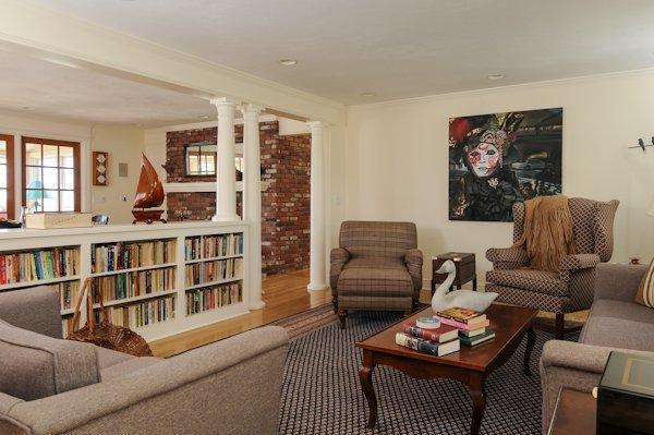 30 Leonard Road East Sandwich, MA 02537 - Photo 8 of 15 a living room with furniture a rug and a book shelf