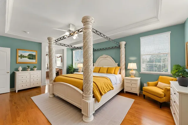 a view of a patio with couches table and chairs and potted plants