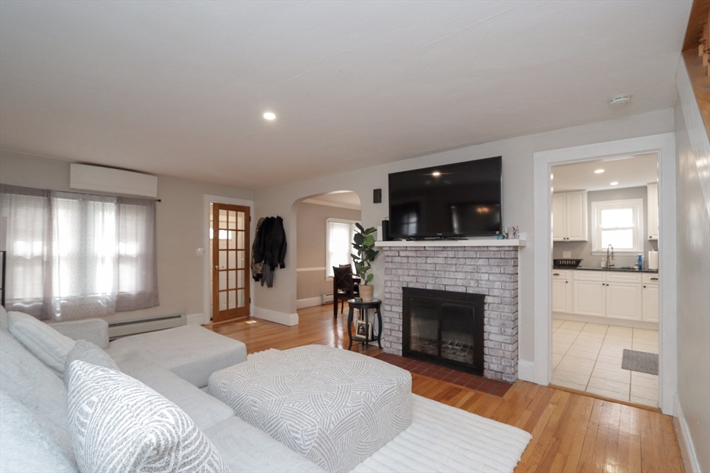 31 Thornton Street Springfield, MA 01104 - Photo 16 of 32 a living room with furniture and a fireplace