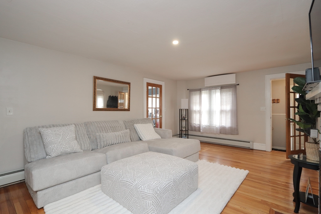 31 Thornton Street Springfield, MA 01104 - Photo 2 of 32 a living room with furniture and a window