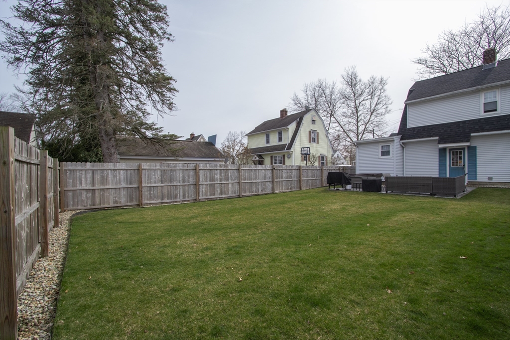 31 Thornton Street Springfield, MA 01104 - Photo 30 of 32 a view of a backyard with a garden and deck