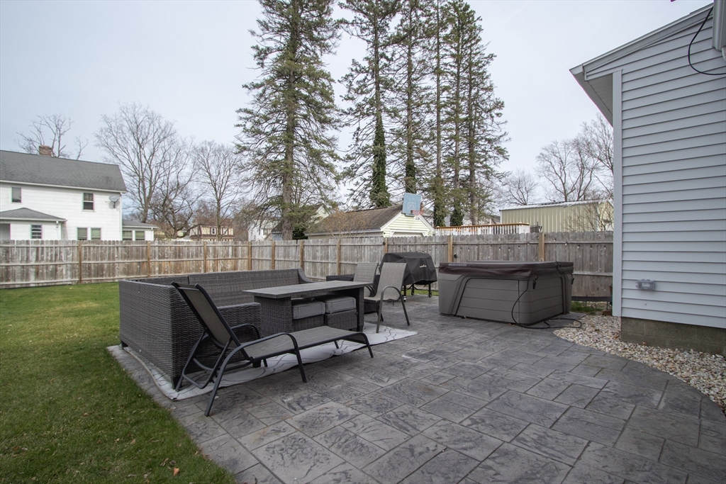 31 Thornton Street Springfield, MA 01104 - Photo 32 of 32 a view of a patio with table and chairs with wooden fence