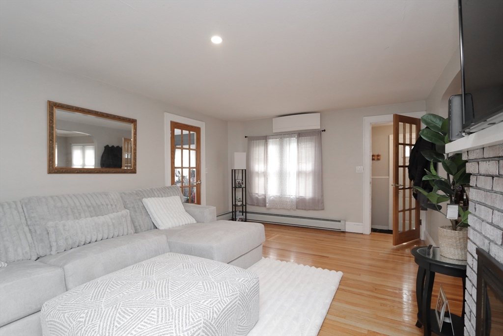 31 Thornton Street Springfield, MA 01104 - Photo 5 of 32 a living room with furniture and a window