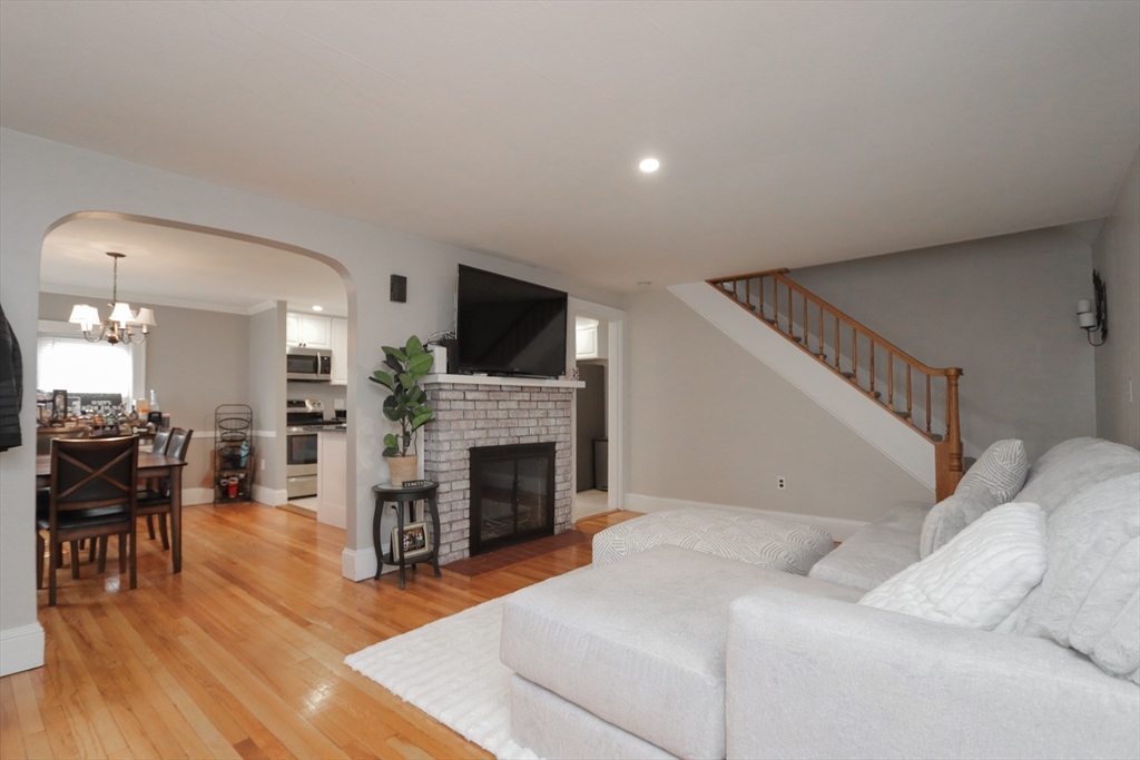 31 Thornton Street Springfield, MA 01104 - Photo 6 of 32 a living room with furniture a fireplace and a flat screen tv