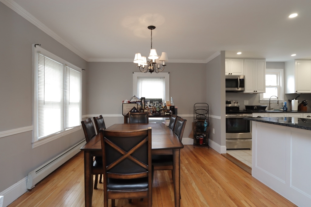31 Thornton Street Springfield, MA 01104 - Photo 7 of 32 a view of a dining room with furniture and wooden floor