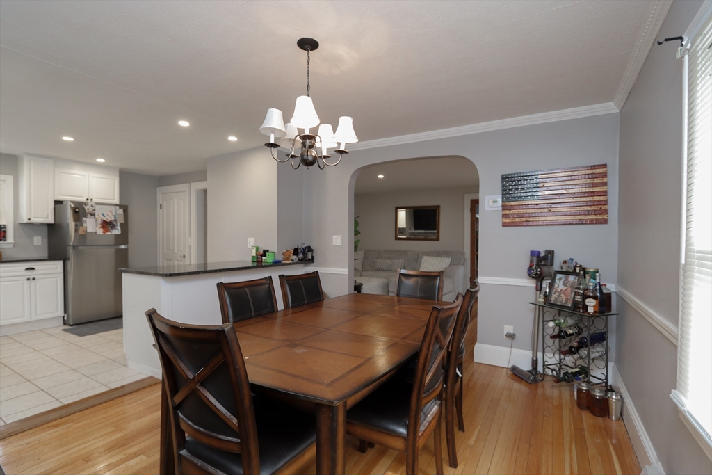 31 Thornton Street Springfield, MA 01104 - Photo 8 of 32 a view of a dining room with furniture and wooden floor