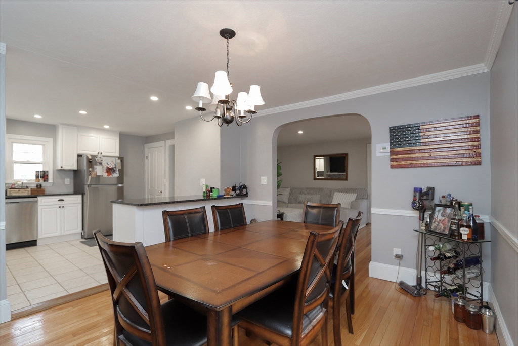 31 Thornton Street Springfield, MA 01104 - Photo 9 of 32 a view of a dining room with furniture and wooden floor