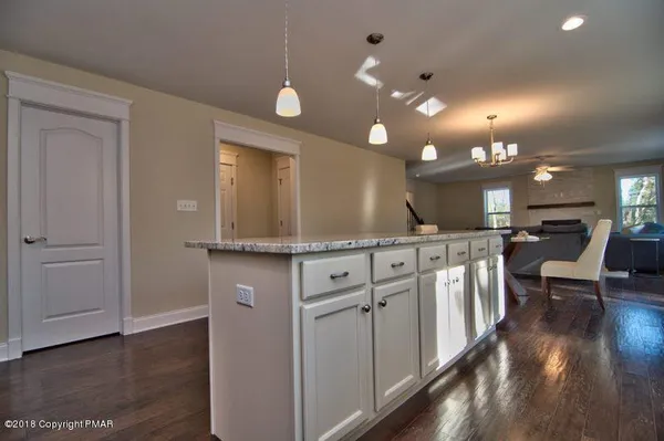a view of a kitchen with a sink and cabinets