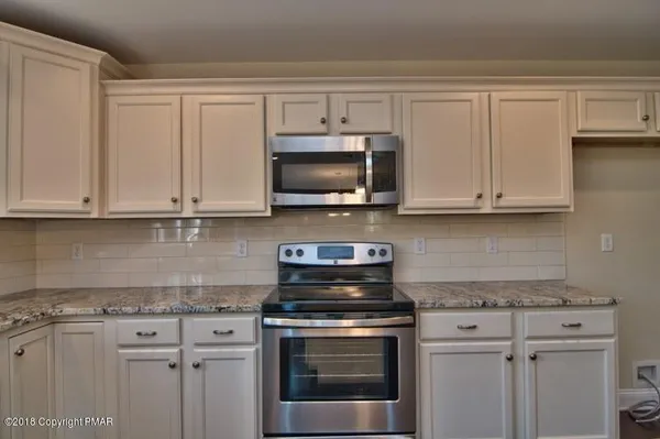 a view of cabinets and wooden floor
