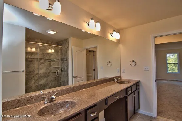 a view of a bedroom from a hallway