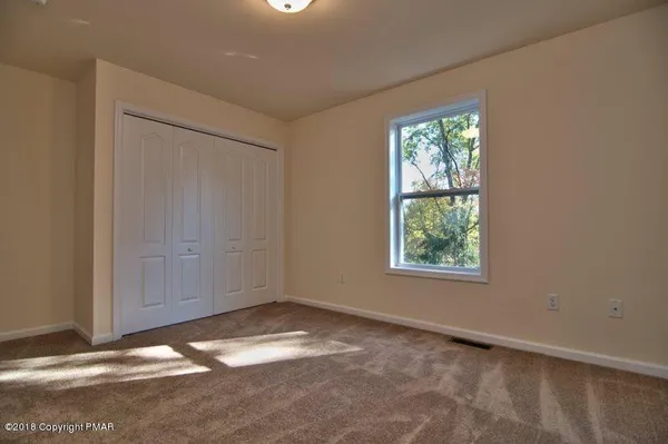 a view of a hallway with closet