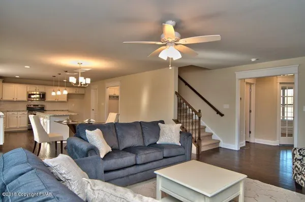 a view of a livingroom with furniture and wooden floor