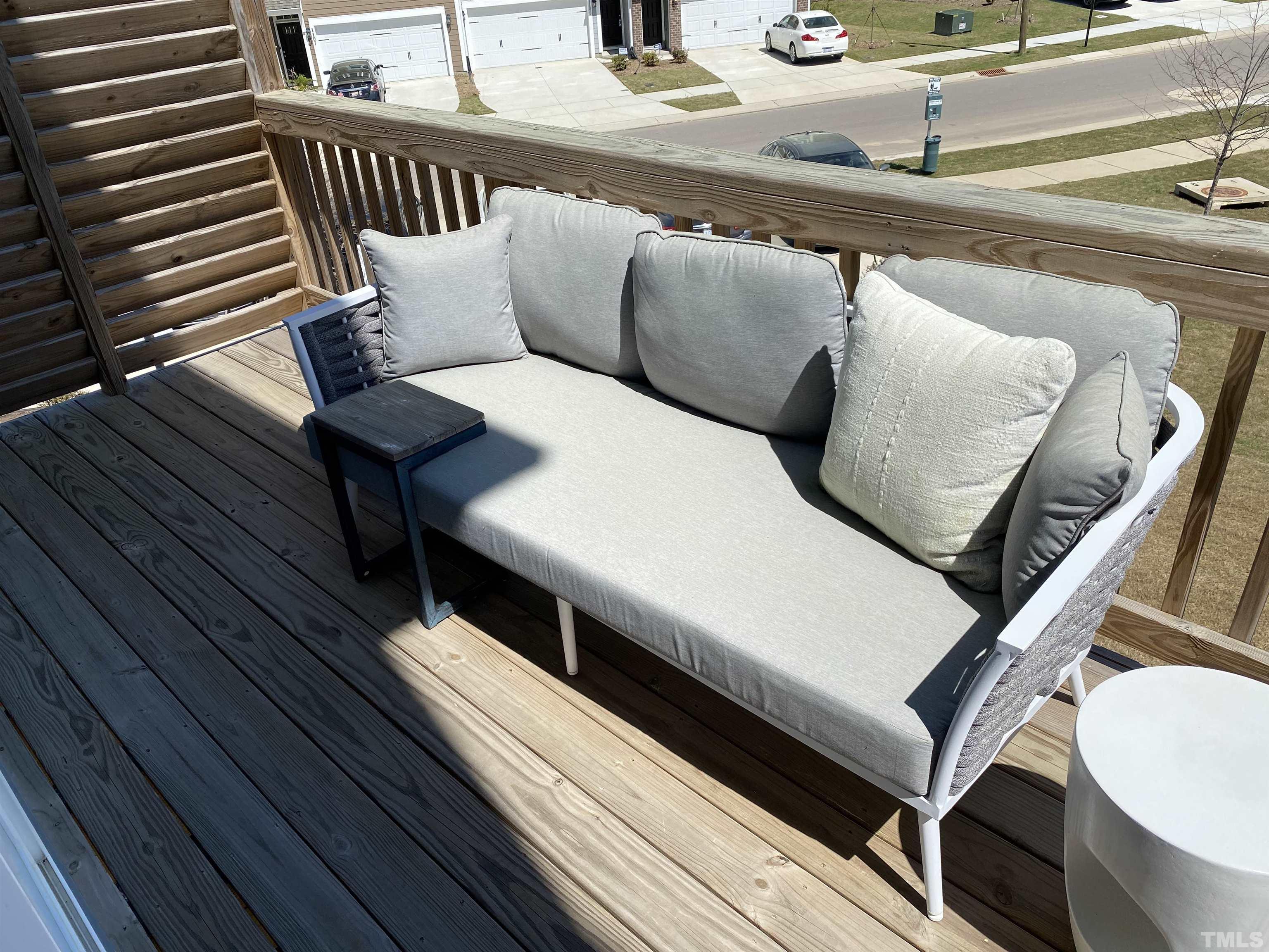 1258 Commack Drive Durham, NC 27703 - Photo 11 of 68 a balcony with wooden floor and furniture