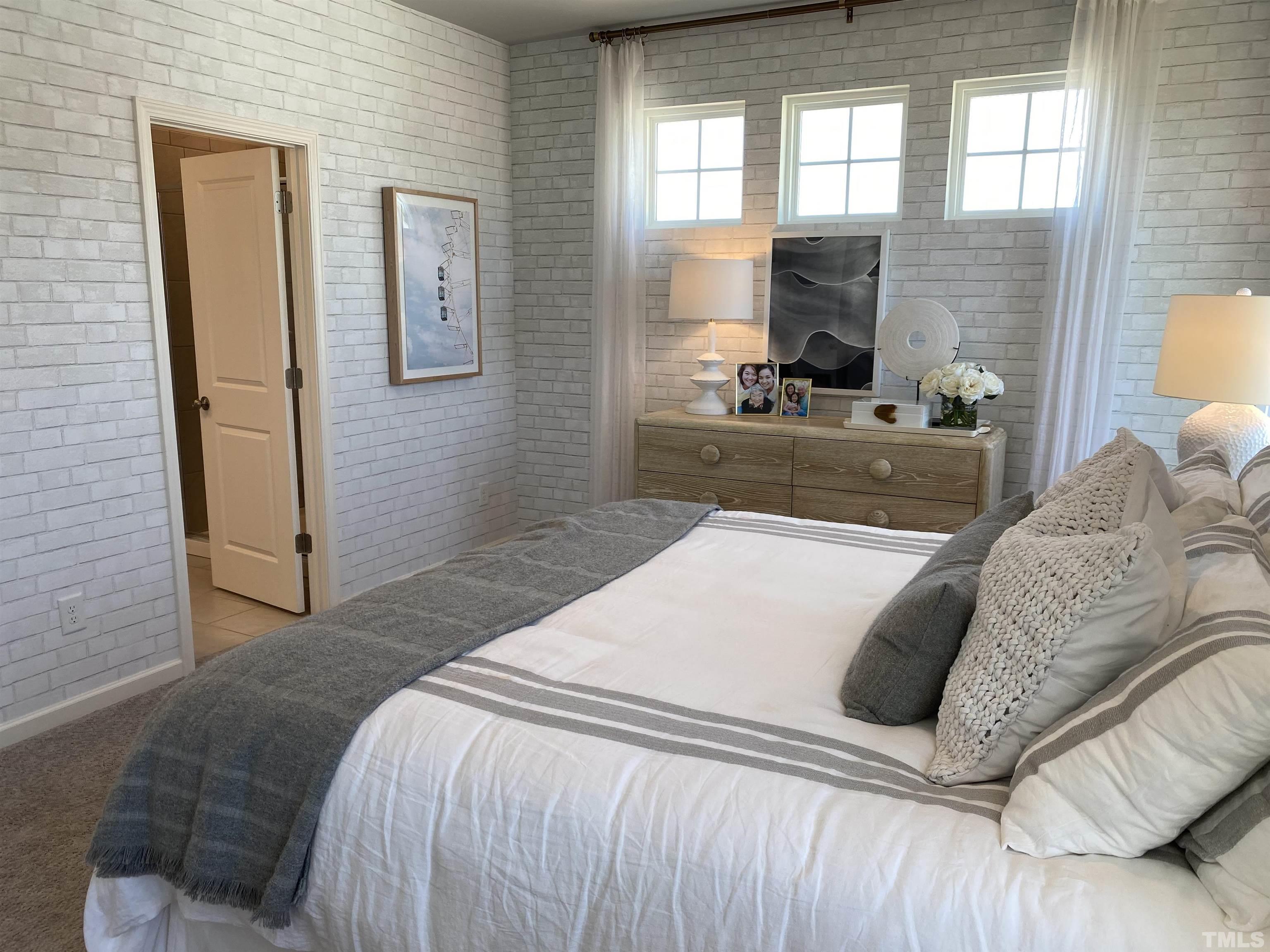 1258 Commack Drive Durham, NC 27703 - Photo 14 of 68 a bedroom with a large bed and a couch