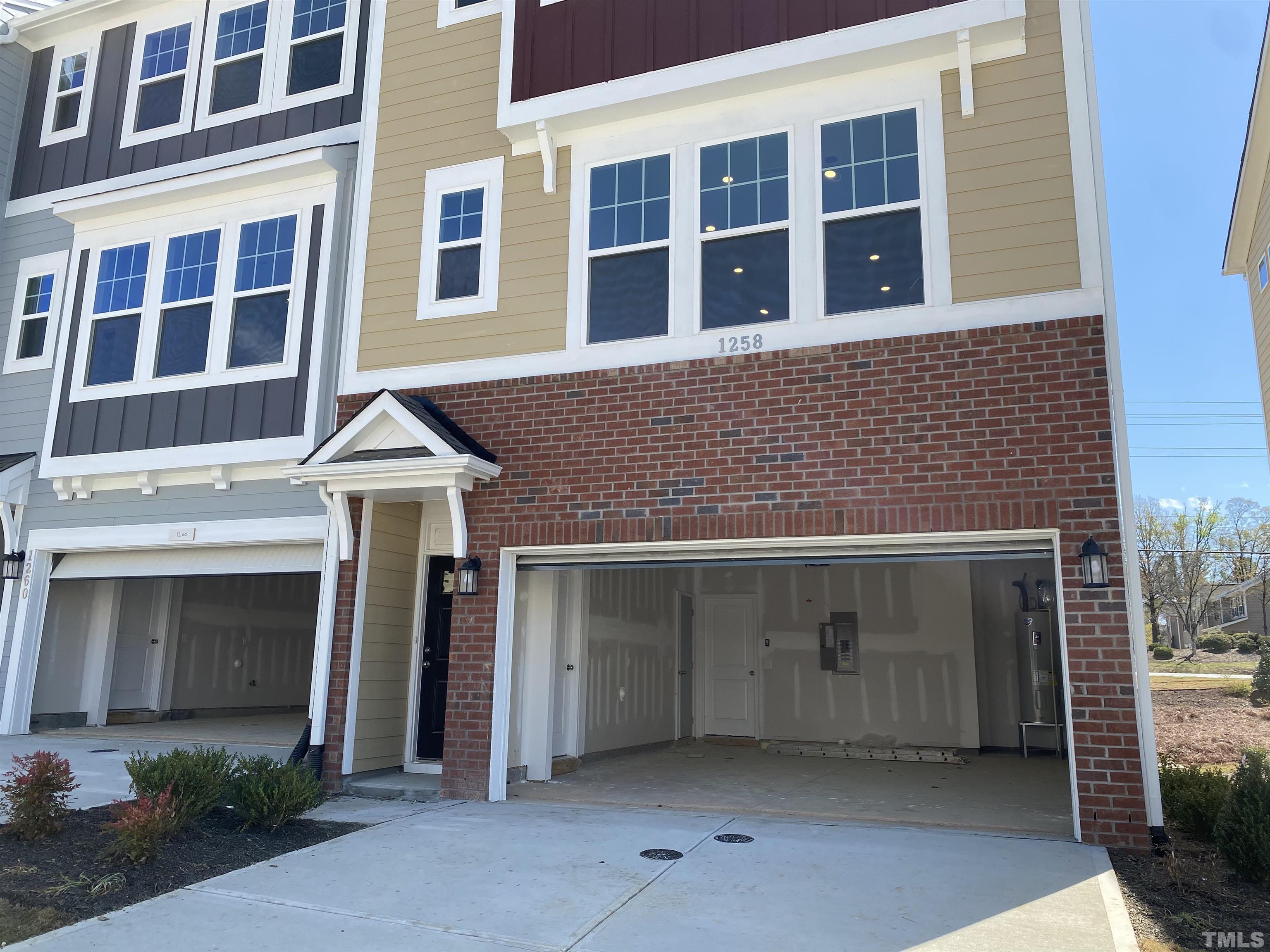 1258 Commack Drive Durham, NC 27703 - Photo 2 of 68 a front view of a house with a yard