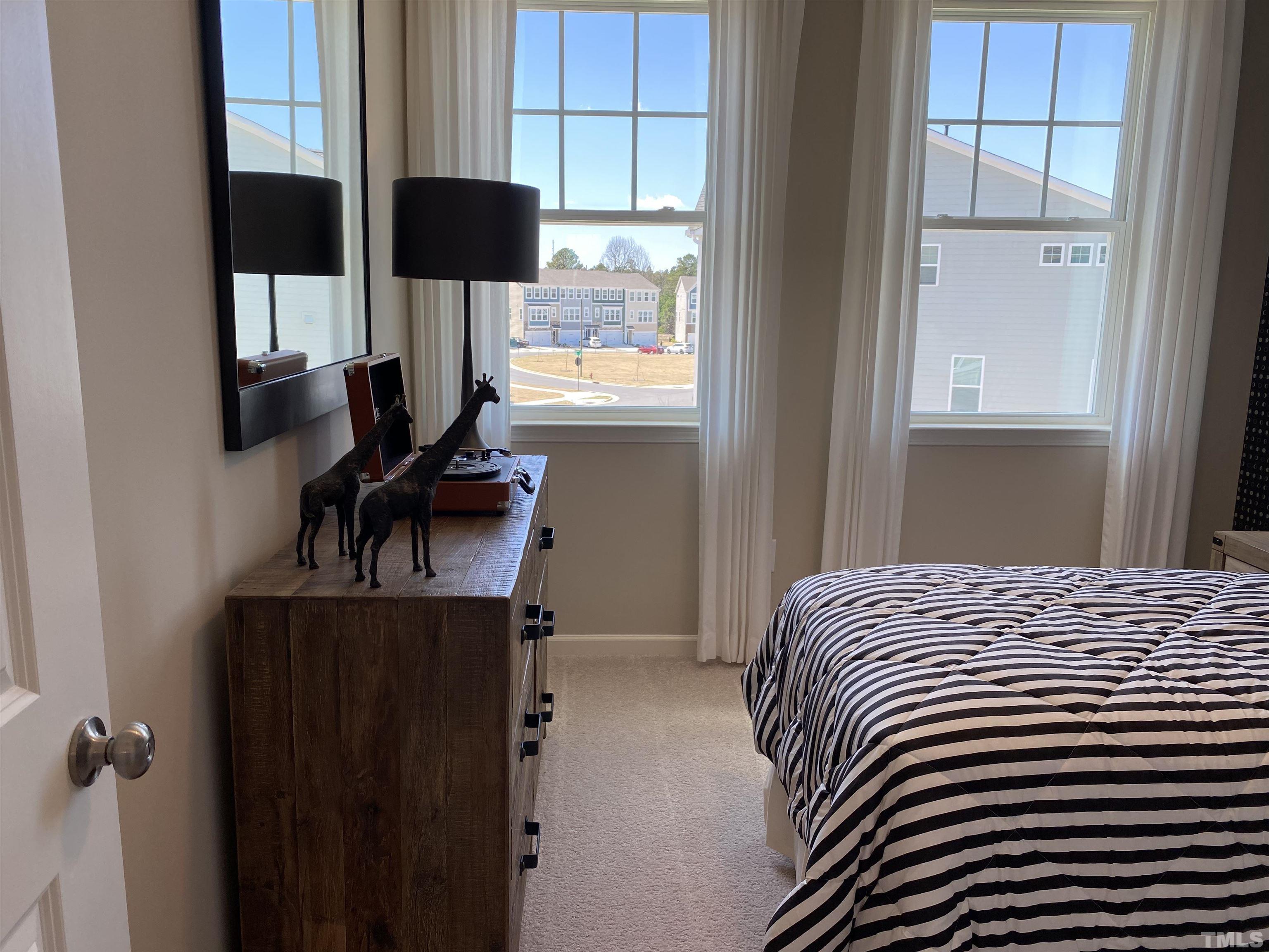 1258 Commack Drive Durham, NC 27703 - Photo 21 of 68 a bedroom with a bed and a window