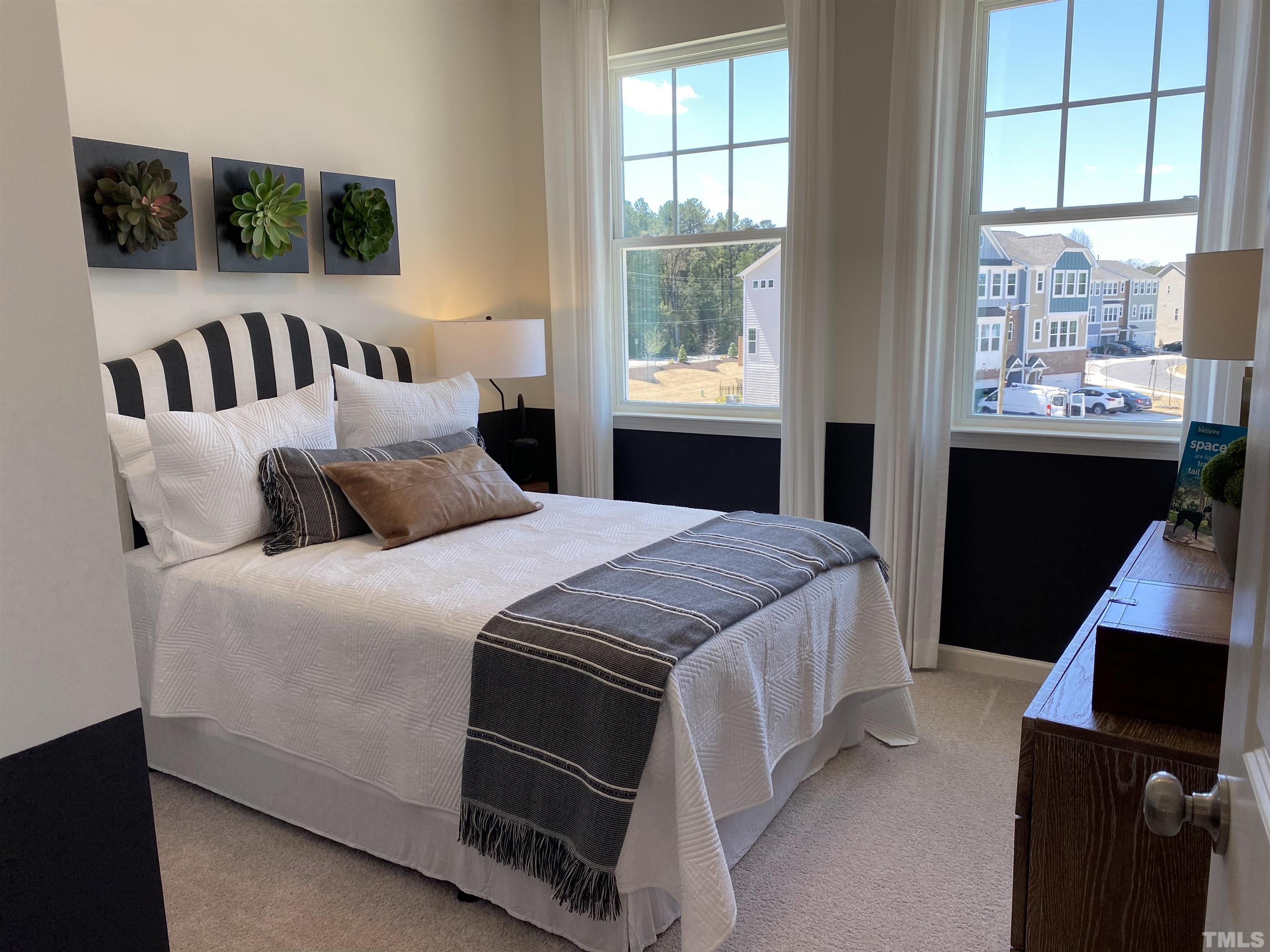 1258 Commack Drive Durham, NC 27703 - Photo 22 of 68 a bedroom with a bed and a window