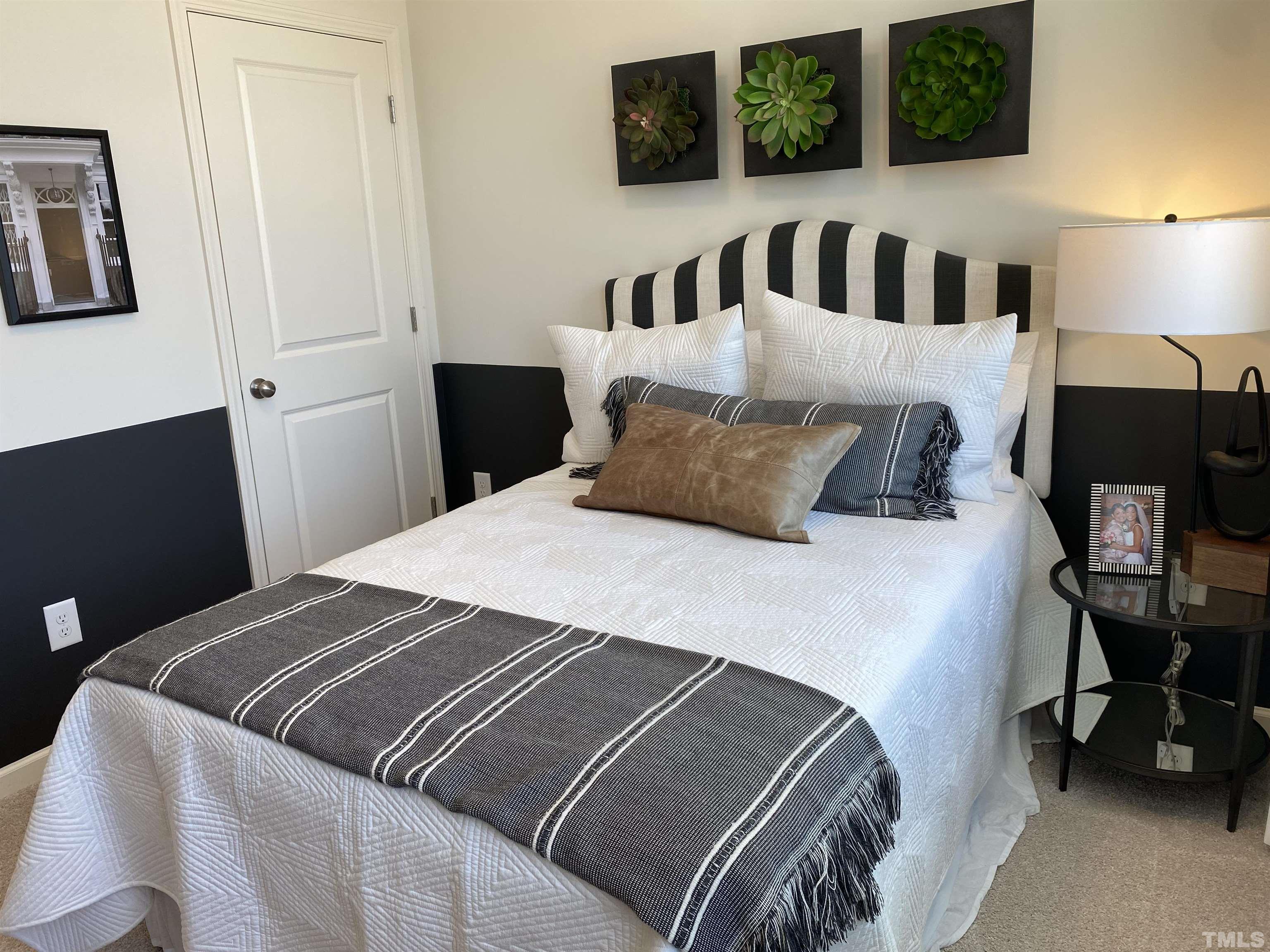 1258 Commack Drive Durham, NC 27703 - Photo 23 of 68 a bedroom with a bed and window
