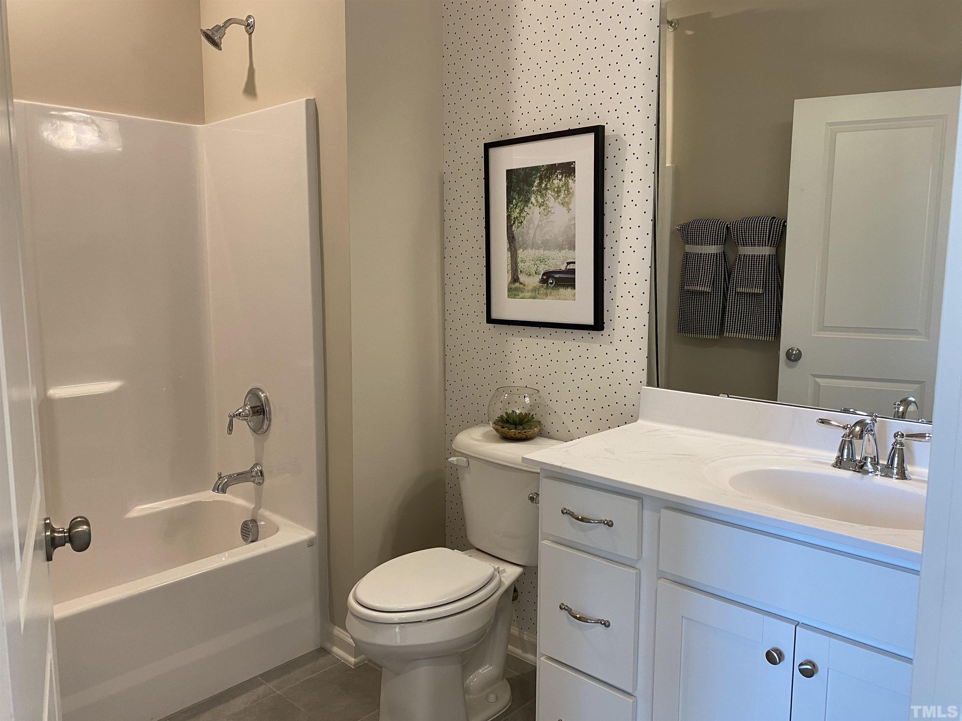1258 Commack Drive Durham, NC 27703 - Photo 24 of 68 a bathroom with a sink a toilet and shower