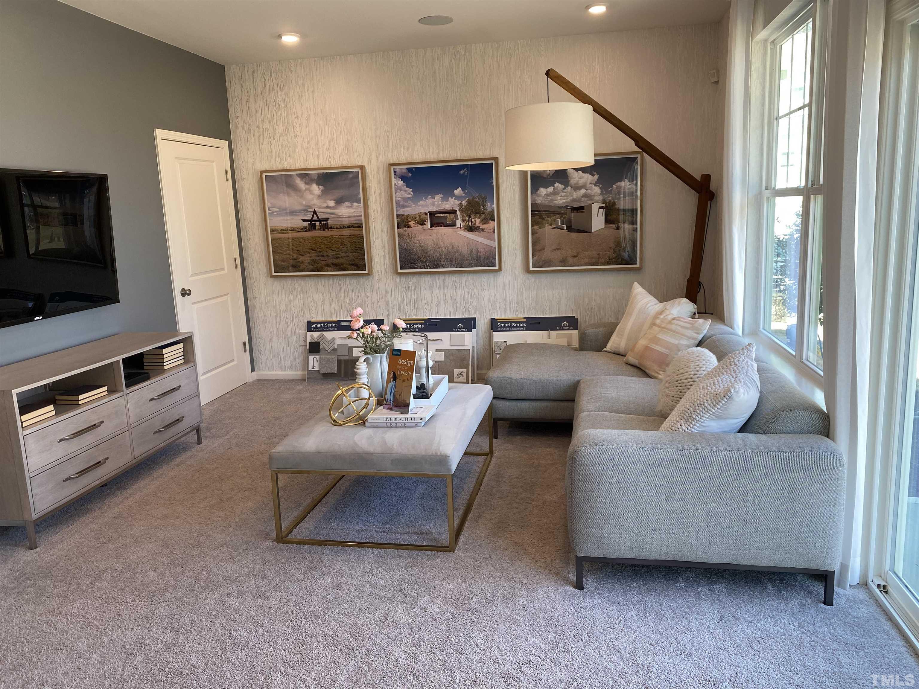 1258 Commack Drive Durham, NC 27703 - Photo 25 of 68 a living room with furniture and a flat screen tv