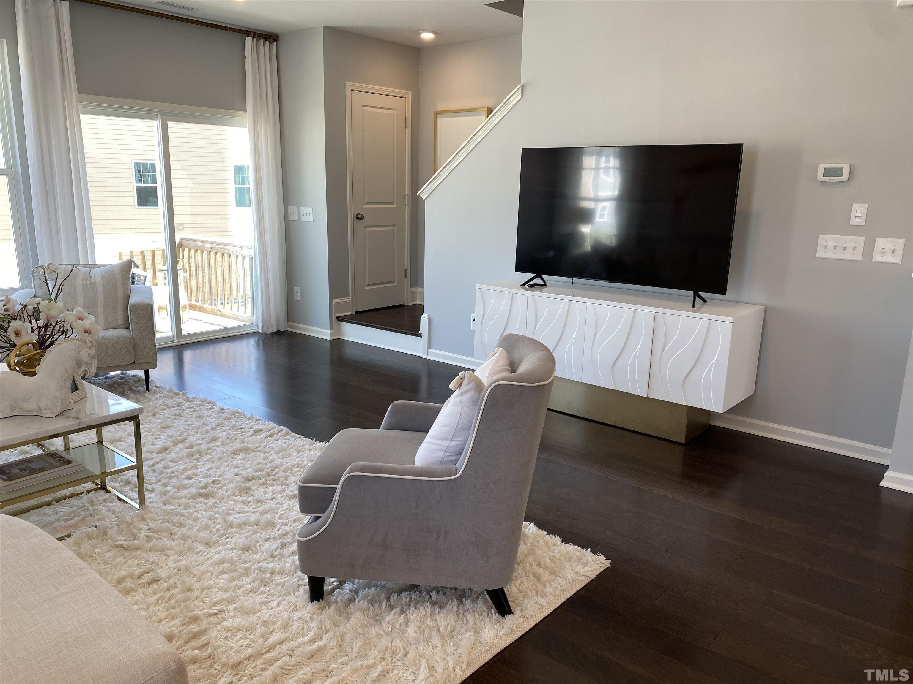 1258 Commack Drive Durham, NC 27703 - Photo 5 of 68 a living room with furniture and a flat screen tv