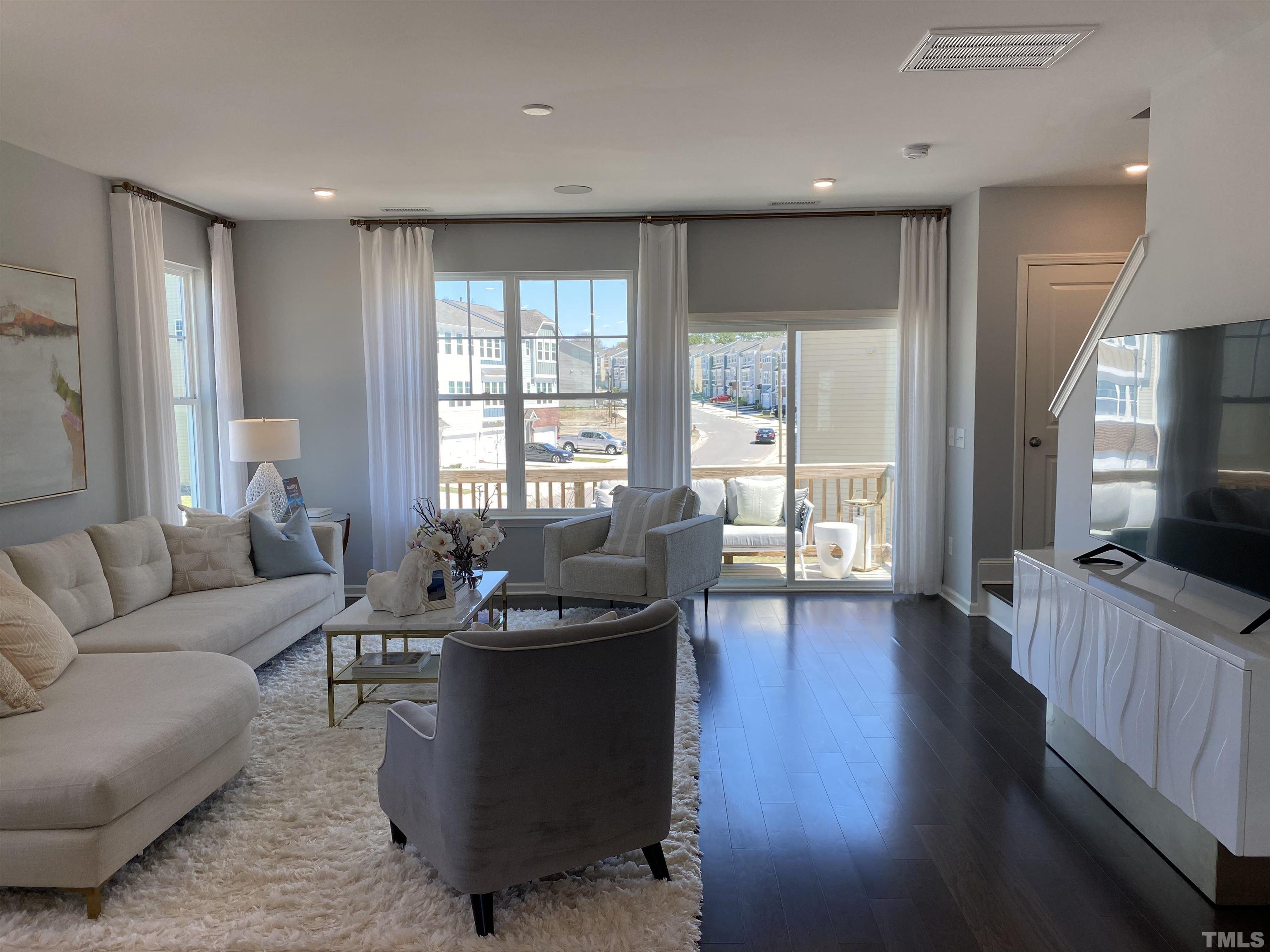 1258 Commack Drive Durham, NC 27703 - Photo 6 of 68 a living room with furniture and a wooden floor