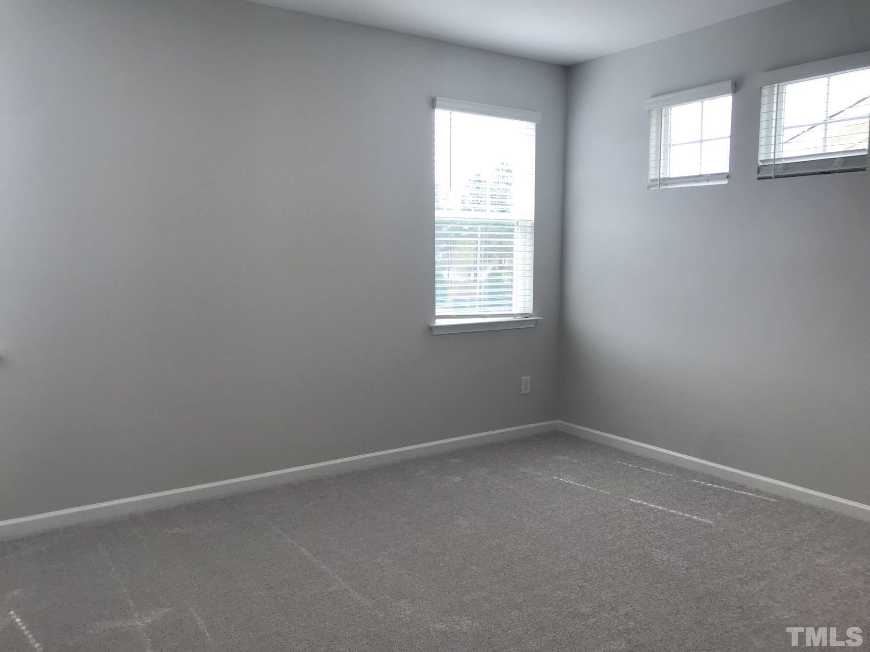 1258 Commack Drive Durham, NC 27703 - Photo 61 of 68 an empty room with windows